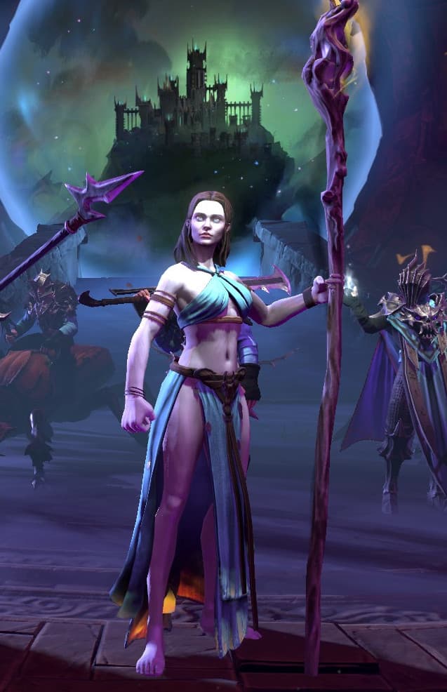 A 3D fantasy character dressed in a light blue and white flowing robe with exposed midriff stands wielding a magical staff with purple crystals. In the background looms a dark, gothic castle silhouetted against a misty green sky with a large moon. The scene is atmospheric with purple and blue lighting effects, and mysterious armored figures can be seen in the shadows on either side.